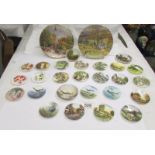 Twenty four miniature collector's plate and two larger examples.