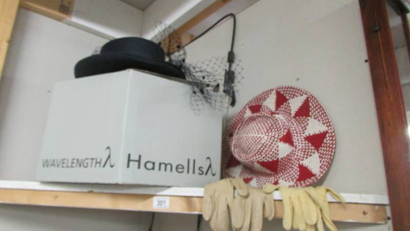 A vintage hat box, hats and gloves.