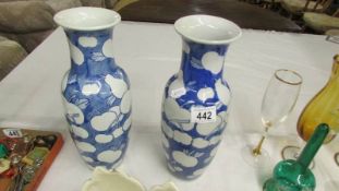 A pair of blue and white vases.