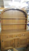 A good quality light oak arched top dresser.