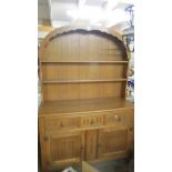 A good quality light oak arched top dresser.