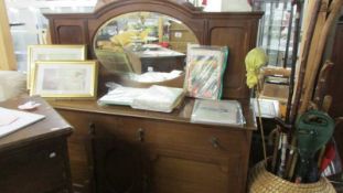 A mahogany mirror backed sideboard.