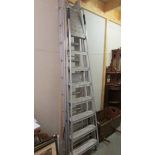 An aluminium ladder and two step ladders.