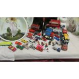 A mixed lot of play worn die cast cars.