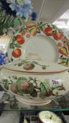 A Victorian fruit decorated tureen and a later fruit decorated plate.