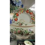 A Victorian fruit decorated tureen and a later fruit decorated plate.