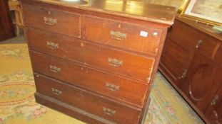 A two over three mahogany chest of drawers.