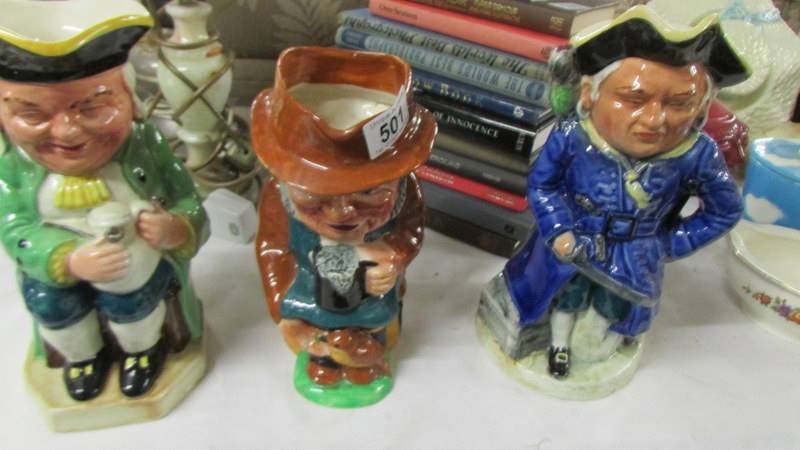 A Winston Churchill Toby jug and two others.