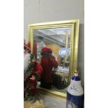 A gilt framed bevel edged mirror, 85 x 65 cm,