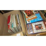 Two boxes of assorted books.