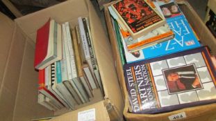 Two boxes of assorted books.