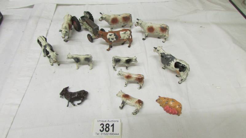 A quantity of lead cows, tractor etc.