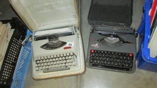 Two portable typewriters.