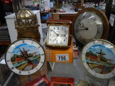 A quantity of vintage mantel clocks including brass Smith's lantern clock.