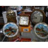 A quantity of vintage mantel clocks including brass Smith's lantern clock.