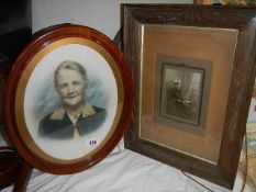 An oval portrait of a lady and one other.