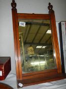 A mahogany framed mirror.