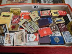 A mixed lot of match books and match boxes.