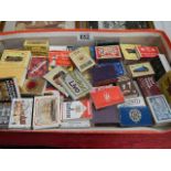 A mixed lot of match books and match boxes.