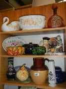 Two shelves of ceramics including Toby jug.