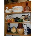 Two shelves of ceramics including Toby jug.