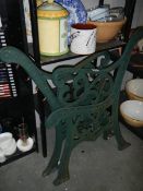 A pair of cast iron garden bench ends.