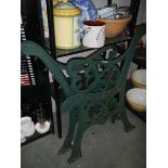 A pair of cast iron garden bench ends.