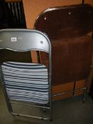 Two vintage folding chairs.