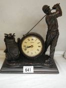 A golf related mantel clock.