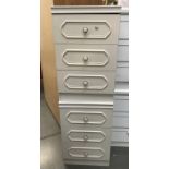 2 three drawer white bedroom chests.