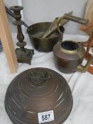 A mixed lot of brass and copper including brass saucepan, hot water bottle etc.