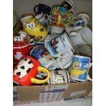 A box of assorted mugs.