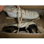 A boxed pair of vintage ice skates.