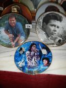 Four Cliff Richard collector's plates and a Michael Jackson plate.
