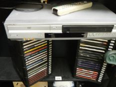 A DVD player and a quantity of CD's.