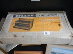 A boxed Tilley-Tuckaway LP gas grill.