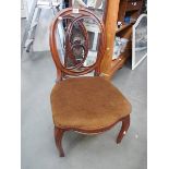 A Victorian mahogany nursing chair.