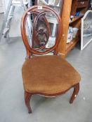 A Victorian mahogany nursing chair.