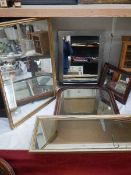 Four assorted framed mirrors.