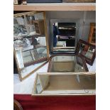 Four assorted framed mirrors.