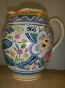 A pottery jug in the style of Poole pottery.