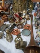 A mixed lot of brass and copper including hunting horn, primus stove, blow lamp etc/.