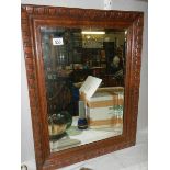 An oak framed mirror.