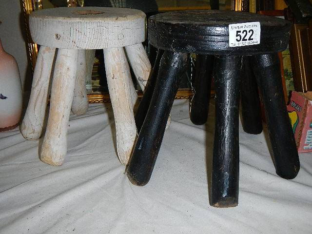 Two old washing dollies, missing handles.