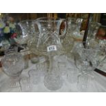 A mixed lot of cut and crystal glass including jugs, vases etc.