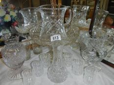 A mixed lot of cut and crystal glass including jugs, vases etc.