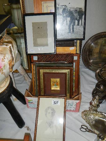 A large lot of old picture frames and a pencil drawing.