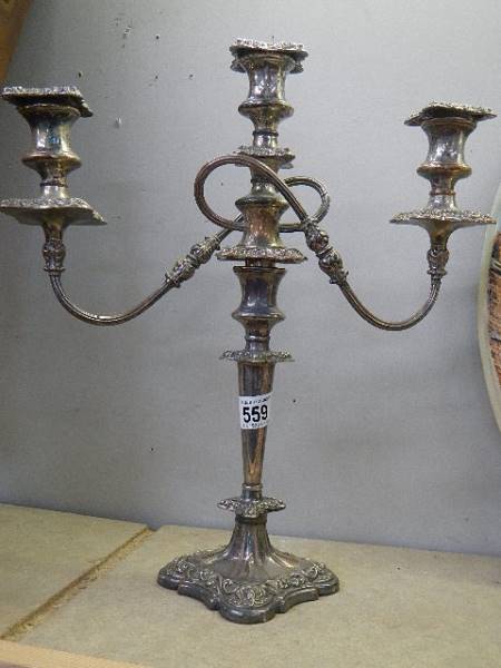 A silver plate candelabra.