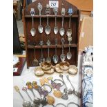 A mixed lot of souvenir spoons, napkin rings etc.