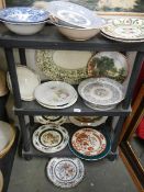 Three shelves of assorted plates.